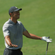 Tiger Woods reacts during a practice round prior to the Masters at Augusta National Golf Club on April 9, 2019, in Augusta, Georgia.